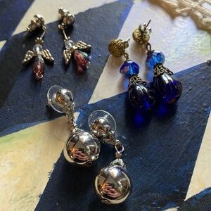 Three pairs of short dangly earrings